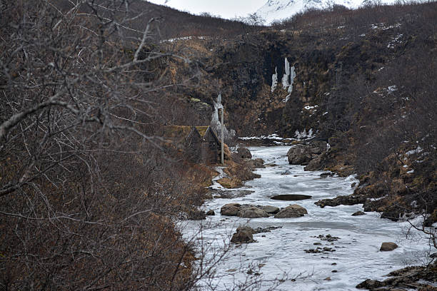 Cold waterway winding through wintry landscape with peaceful ambiance