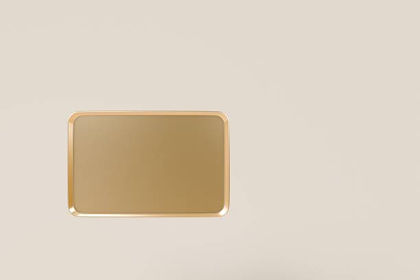 istock 3d Rectangle Golden with smooth texture icon. Luxurious dining and elegant presentations concept. Minimal Golden plate kitchen a sleek reflective surface Isolated on transparent background. 3d render. 2253800897