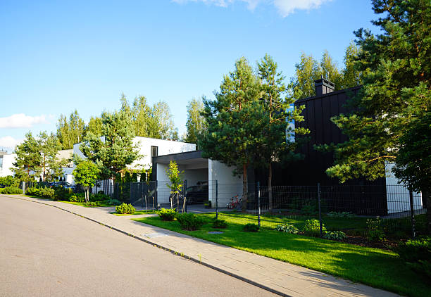 Modern country cottage with barbecue area and trees around