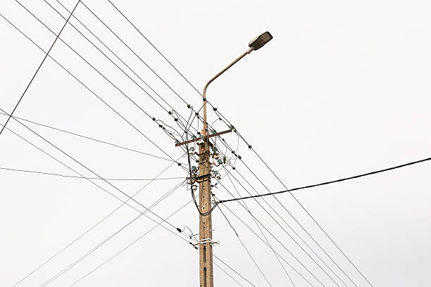istock Utility pole with power lines. Urban infrastructure detail. Electricity distribution network outdoors. 2253803361