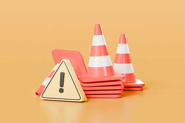 istock 3D red traffic cones with yellow triangle warning symbol icon on isolated yellow background. accident prevention concept. Cartoon minimal icon to transport element. copy space. 3d render illustration. 2253804007