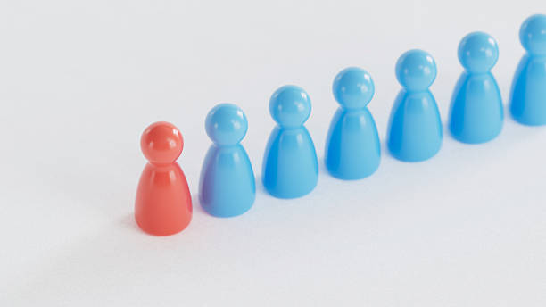 istock Single Red Piece: Standing Beside Blue Counterparts 2253804324