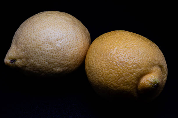 imperfect lemon yellow color on white background close-up, horizontal view