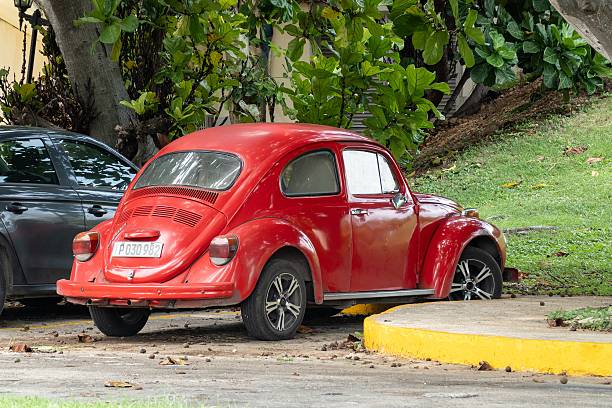 Varadero, Cuba - September 2, 2023: Red legendary VW Beetle car parked on street
