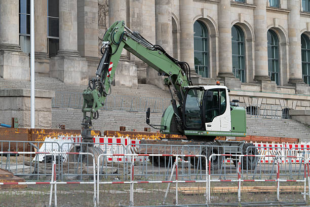 istock Wheeled Hydraulic Excavator at Urban Construction Site 2253809522