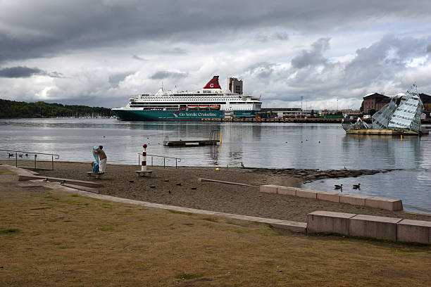 Oslo Fjord with a huge cruise ship captured during cloudy day in summer season.