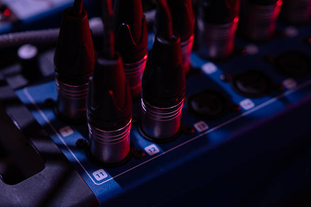 Tangled electrical cables coiled, essential for stage setups, lighting, audio production, and live performances. A behind-the-scenes look at concert equipment.
