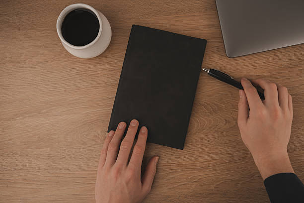 istock A clean and inviting workspace features a laptop, a coffee cup, and a notebook, creating an ideal environment for studying at home. The warm wood surface enhances focus and comfort 2253814022