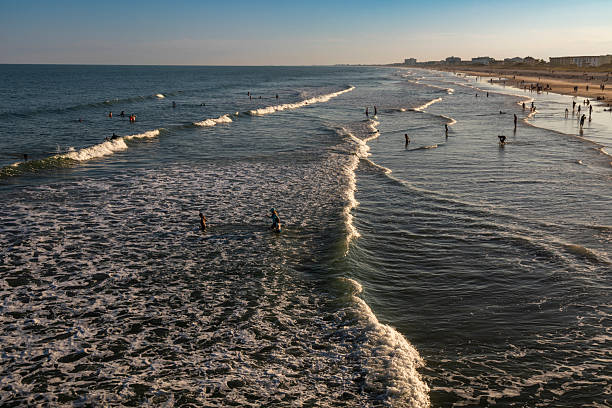 istock Beachgoers Enjoy Shallow Surf at Cocoa Beach, Florida 2253814050