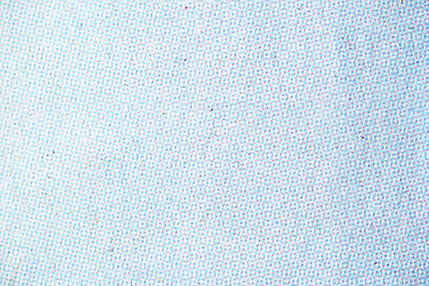 Light Cyan and Magenta Halftone Dots on White Printed Paper