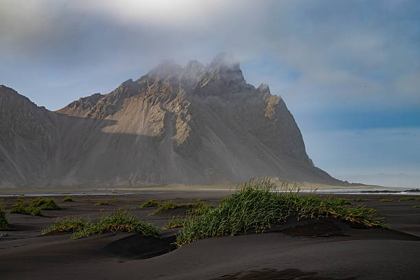 istock Black beach with mountains in the background in Iceland 2253818442