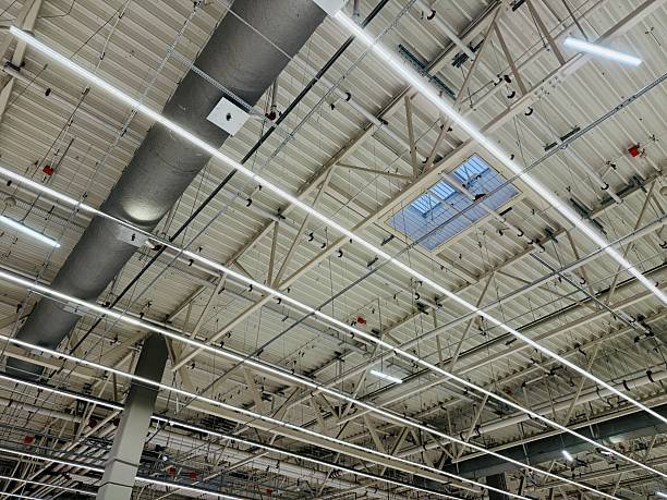 istock Warehouse Illuminated With Energyefficient Lights, Industrial Facilities Equipped With Large Windows And Energysaving Lighting To Maximize Natural And Artificial Illumination 2253821208