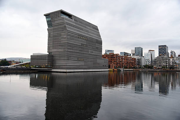 Oslo and and the famous Munch museum which opened in 2021. Captured during a cloudy day in summer season.