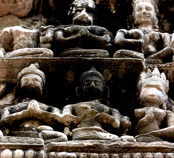 Shot in color detail on the facade of this historic building representing some character, animal or flower. Set at Siem Reap, Angkor Wat , Cambodia, Asia