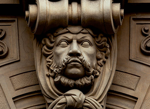 Shot in color detail on the facade of this historic building representing some character, animal or flower. Set at Eixample, Barcelona, Catalunya, Spain, Europe