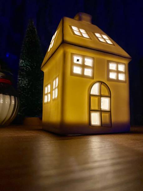 istock Christmas decoration. House-shaped illuminated night lamp. 2253832956