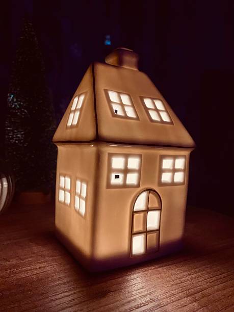 istock Christmas decoration. House-shaped illuminated night lamp. 2253832957