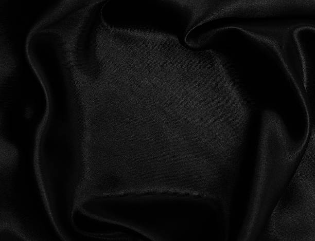 istock Smooth elegant black silk or satin texture as abstract background. Luxurious background design 2253833972