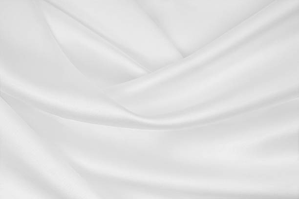 istock Smooth elegant white silk or satin luxury cloth texture as wedding background. Luxurious background design 2253834011