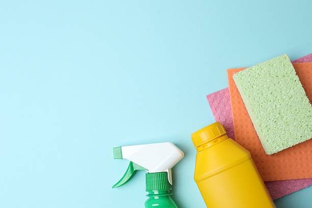 istock Many different house cleaning products on color background, top view 2253838704