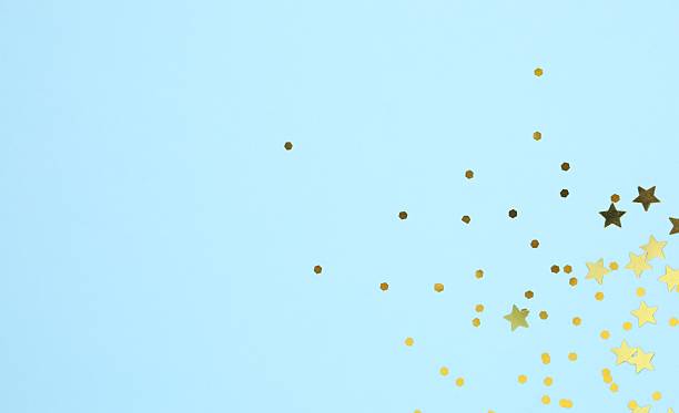 istock Golden confetti on color background, top view 2253839075