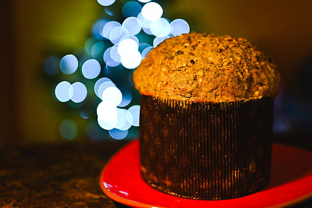 Closeup of Christmas bread with dishtowel and Christmas lights in background