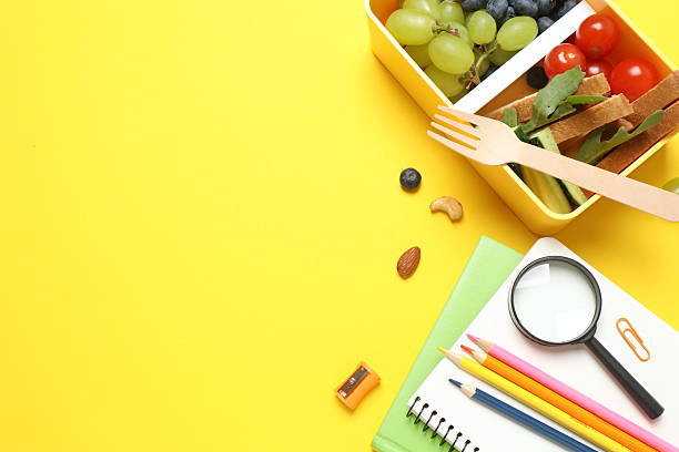 istock Packed lunch with sandwiches, fruits, nuts and vegetables in a divided container 2253840006