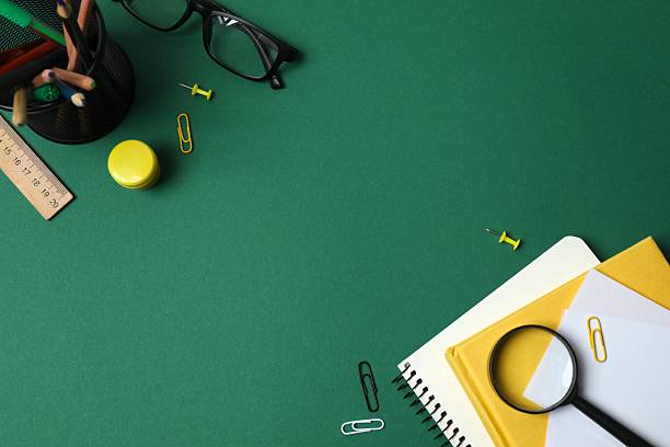 istock Flat lay with school stationery on green background, top view 2253840020