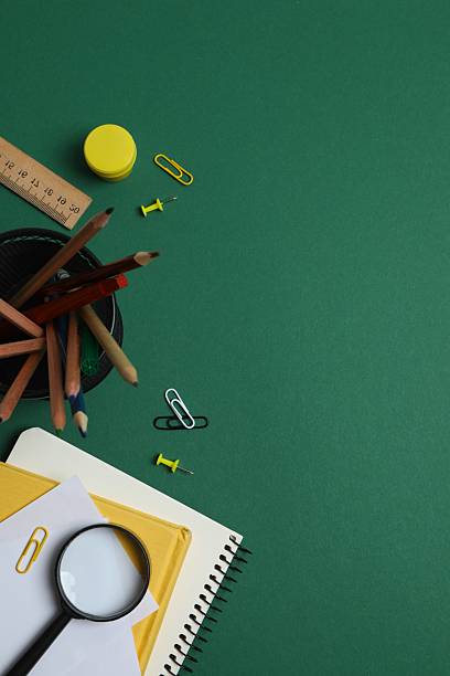 istock Flat lay with school stationery on green background, top view 2253840037