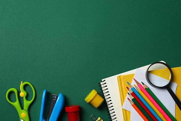 istock Flat lay with school stationery on green background, top view 2253840072