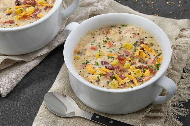 Corn and potato chowder served with bacon, cheddar cheese and crusty bread.