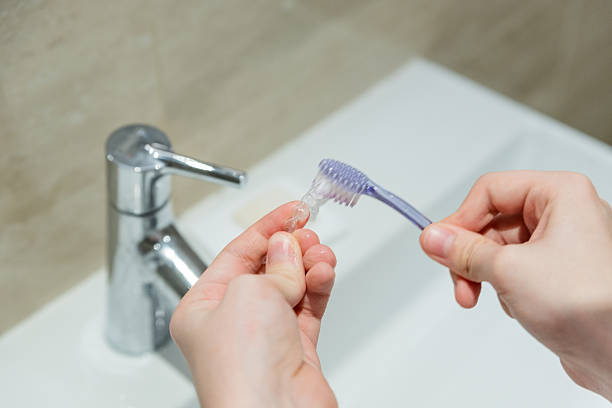 istock Teen Girl Using Modern Clear Aligner For Teeth Straightening Routine 2253841510