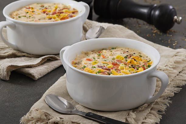 Corn and potato chowder served with bacon and crusty bread.