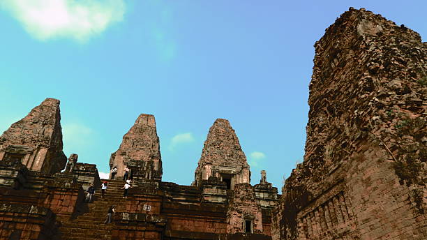 Explore the intricate stonework of Angkor Thom temple in Cambodia. This historical site showcases awe-inspiring craftsmanship and reflects the nation's rich cultural and architectural heritage.