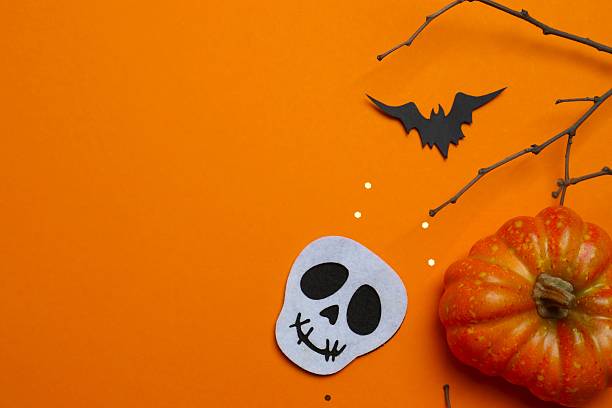 istock Vertical Halloween festive background design featuring bats, skull and decorative branches. Halloween concept 2253842085