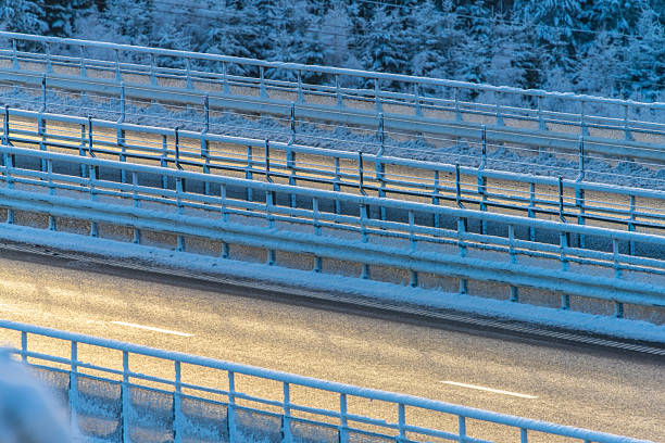 Icy winter road bridge with frost and snow