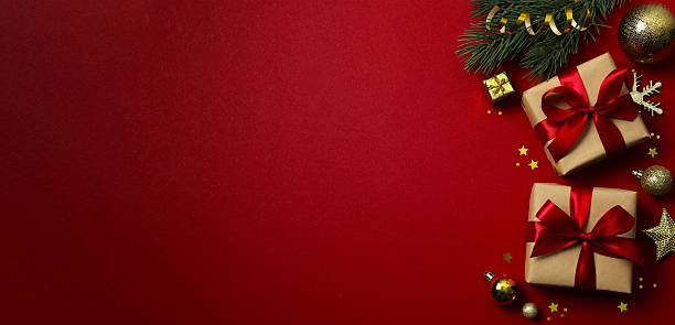 istock Festive banner with gift boxes and Christmas embellishments, creating festive joy. Top view, space for text 2253844006