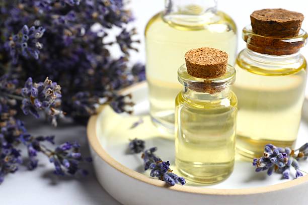 istock Aromatic essential oil and lavender flowers on the table 2253844049