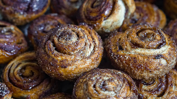istock Cinnamon rolls with sugar crust and spiral texture 2253845957