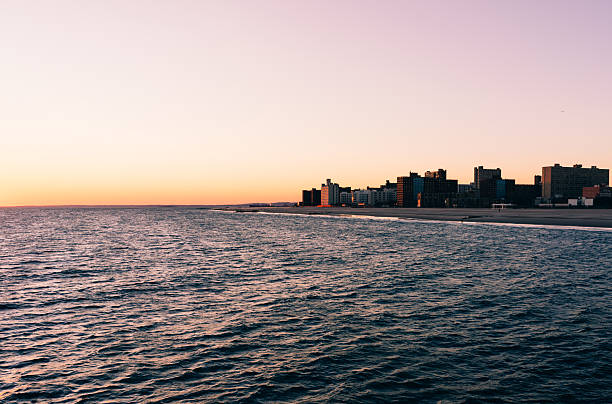Brighton Beach, Brooklyn, NY, USA - A few people walking down the famous boardwalk.