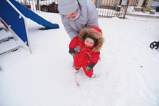 Winter Walk with Toddler in Snowy Playground