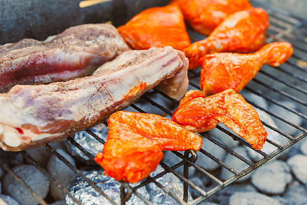 CloseUp of Grilled Meats on a Barbecue Grill An Ultimate Culinary Delight That Tempts the Palate and Promises a Satisfying Dining Experience with Friends and Family Gathered Around