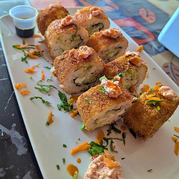 Crispy breaded fusion style sushi rolls, served with spicy dressing