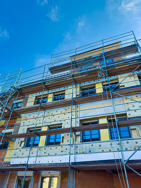 istock A modern building is currently under construction, featuring scaffolding that supports its structure against a stunningly clear blue sky, highlighting the ongoing urban development efforts 2253853256