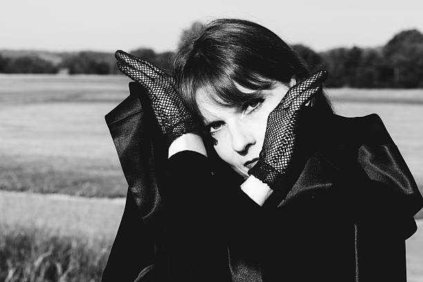 Black and white portrait expressing vulnerability, tension, and introspection
