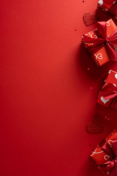 istock A vertical vibrant red valentines scene features wrapped gift boxes, ribbons and small hearts, conveying romance, affection, and celebration perfect for Valentineâs Day 2253853708