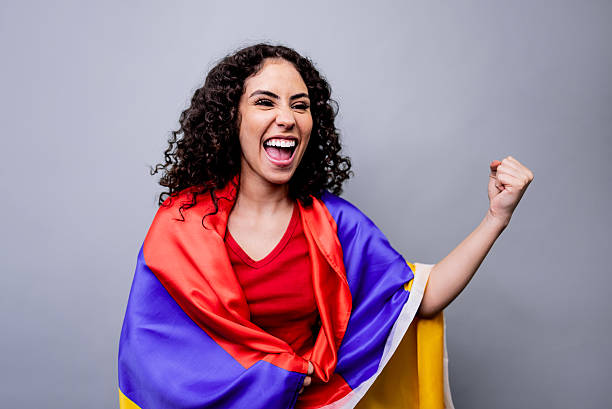 Passionate colombian fan celebrating with national flag