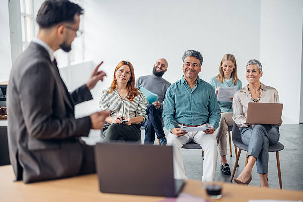 istock Engaged Audience Listening to a Business Presentation 2253858271