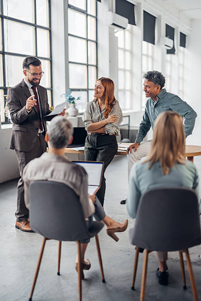 istock Engaged Employees Collaborating in a Meeting 2253858371