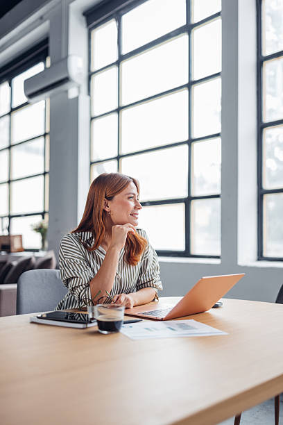 istock Thoughtful Woman Engaged in Online Communication 2253861089